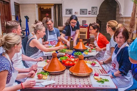 Experience Cooking Class Marrakech.Tourist touching saffron and spices during a food tour in Marrakech before a cooking class.